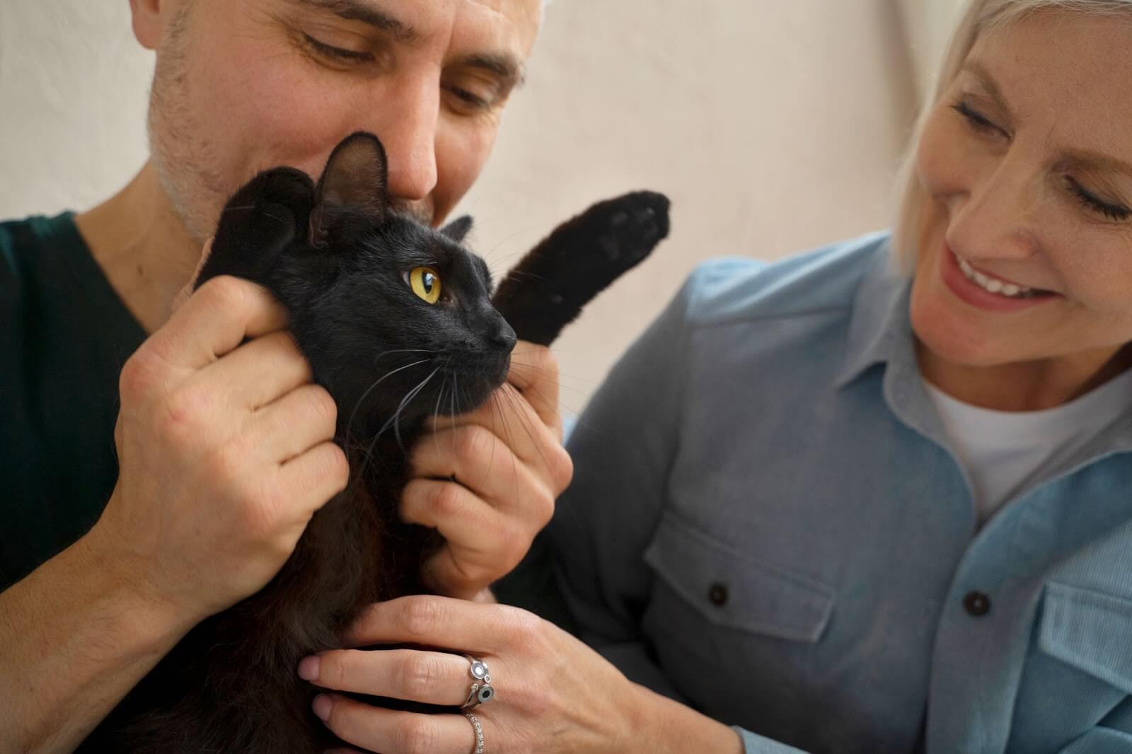 cute black cate with his human parents